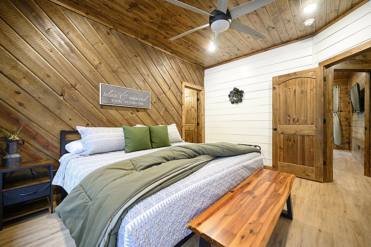 Bedroom with wood accent wall