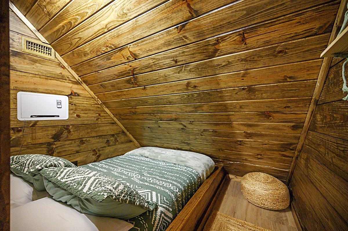 Cozy sleeping nook with full bed