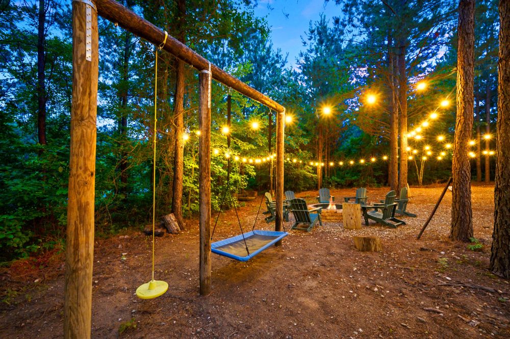 Swings and string lights in the yard